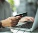 Woman with credit card and laptop